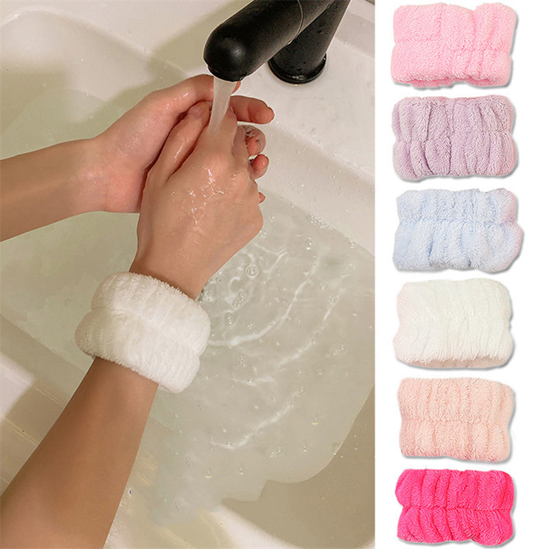 White wrist wash bands worn under a running tap while washing hands, with six colourways shown alongside