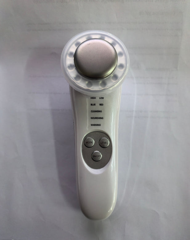 Control panel of the 7-in-1 facial wand showing high and low intensity, blue and red LED, cleansing, nourishing and warming modes