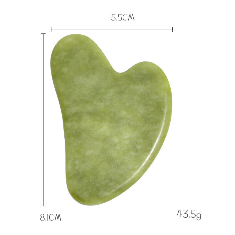 Jade gua sha stone dimensions: 8.1 cm tall, 5.5 cm wide, 43.5 g, heart shaped with a notched jawline edge