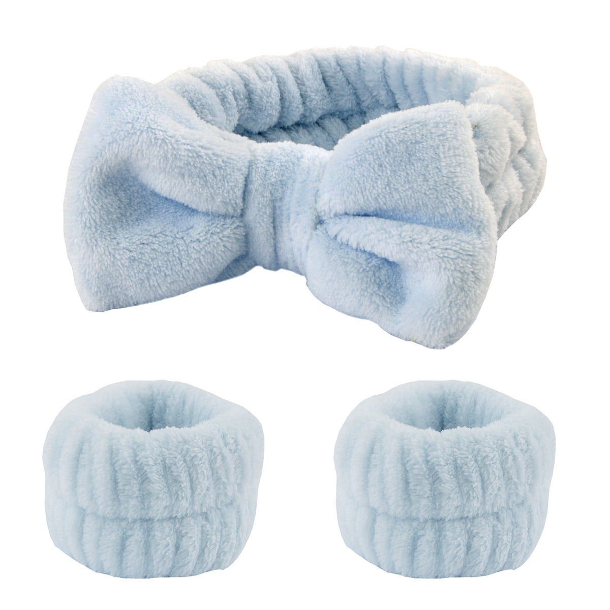 Light blue 3-piece spa set: a bow headband and two matching microfiber wrist wash bands