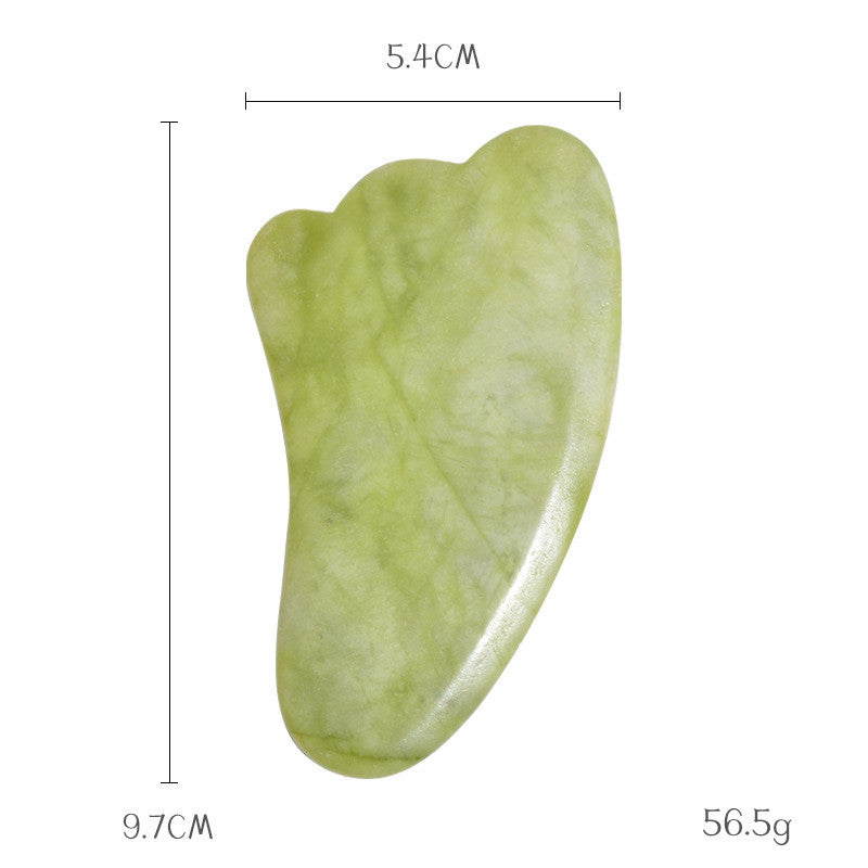 Wing-shaped jade gua sha stone, 9.7 cm by 5.4 cm and 56.5 g, with a long edge for the neck and jawline